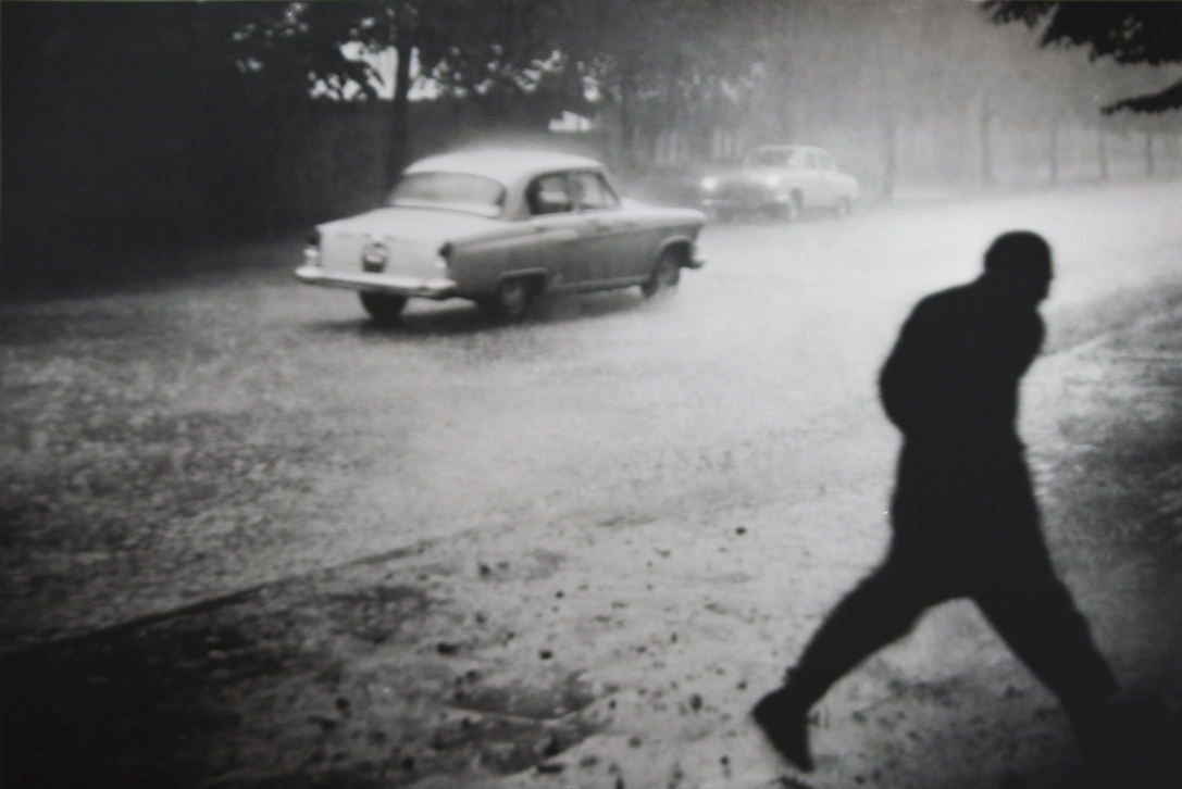 Car in the rain by Antanas Sutkus